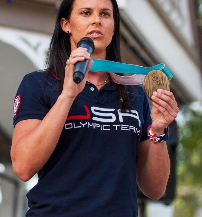 brittany bowe speaking and holding up her gold medal